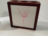 a small wooden box with a picture of a ballerina on it