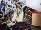 a pile of assorted jewelry and other items on the floor