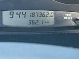 a close up of a speedometer on a car ' s dashboard