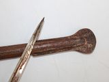 a hammer and a pair of scissors on a table