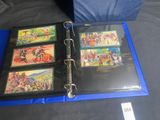 a blue binder with pictures of people on it