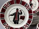 many plates that have a picture of a man on them