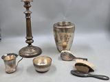a lot of silver items that are on the table