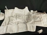 a white piece of cloth with lace on it and a pair of scissors next to it