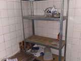 a room with a shelf and a table in it