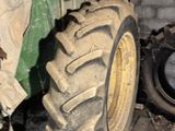 a tractor that is parked next to a brick wall