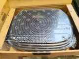 a cardboard box with a set of four plastic trays inside of it