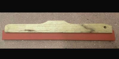a picture of a piece of wood with a red edge
