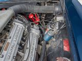 a close up of a car ' s engine with its hood open