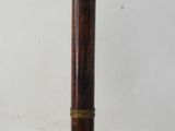 a lamp with a wooden base and a white glass shade