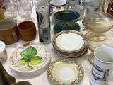 a table with a lot of dishes and cups on it