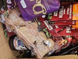 a box full of snacks and snacks sitting on a table