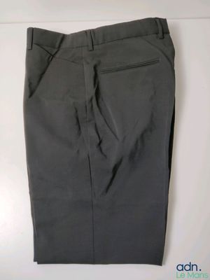 a close up of a gray pants on a white surface