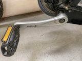 a close up of a bicycle with a chain attached to it