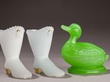 three green and white vases sitting next to each other on a table