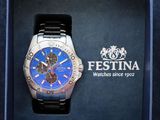 blue and black watch in a blue box with a logo on it