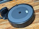 an image of a robot vacuum sitting on top of a wooden floor