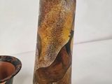 two vases that are sitting next to each other on a table