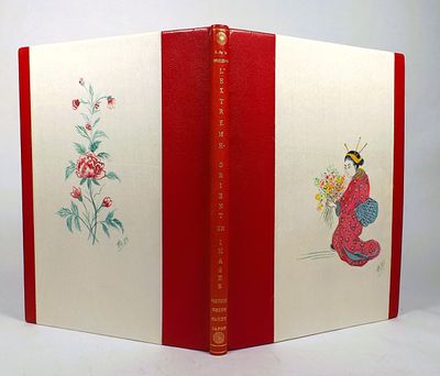 a red and white book with a picture of a bird on it