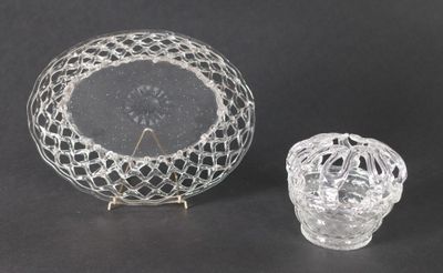 a glass bowl and a glass candle holder on a table
