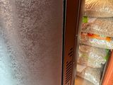 an image of a refrigerator in the middle of a room