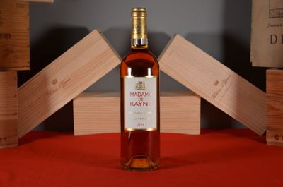 a bottle of wine that is sitting on a table