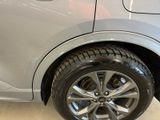 a close up of a car tire on the floor