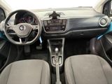 the interior of a small car with a steering wheel and dashboard