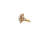 a close up of a gold ring with diamonds on it