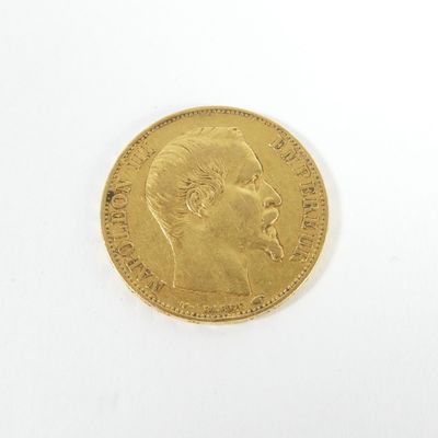 l'image d'une pièce d'or sur laquelle figure le visage d'un homme