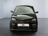a picture of a small black car parked in a room