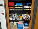 a cabinet with many items in it in a room