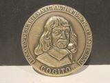 a silver coin with a picture of a man on it