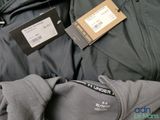 a pile of clothing with a price tag on it
