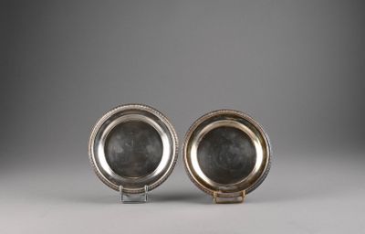 a pair of silver plated dishes on stands