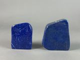a pair of blue stone stud earrings on a white background