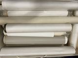 a lot of rolls of white paper in a box