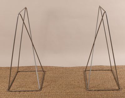 pair of metal triangle bookends on burlock cloth