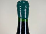 a bottle of wine that is sitting on a table
