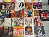 a lot of music books that are on a table
