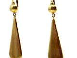 pair of gold tone earrings hanging from a hook on a red and white polka dot background