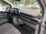 the interior of a car with a view of a parking lot from the passenger seat