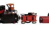 three toy trains on a white background one is red and the other is black