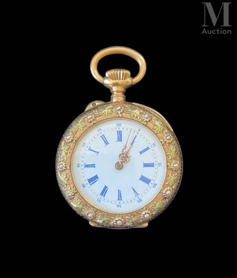 a gold pocket watch with roman numerals on the face