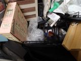 a pile of assorted items in a black basket