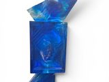 an image of a blue glass sculpture on a white surface