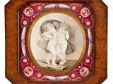 an antique picture of two cherensils in a wooden frame