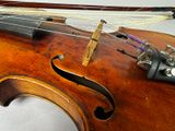 a close up of a violin with strings attached to it
