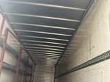 the back of a moving truck with the door open and a box in the back