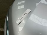 a ruler on the hood of a car that is parked